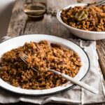 Dark rice in an enamel plate with a fork in it