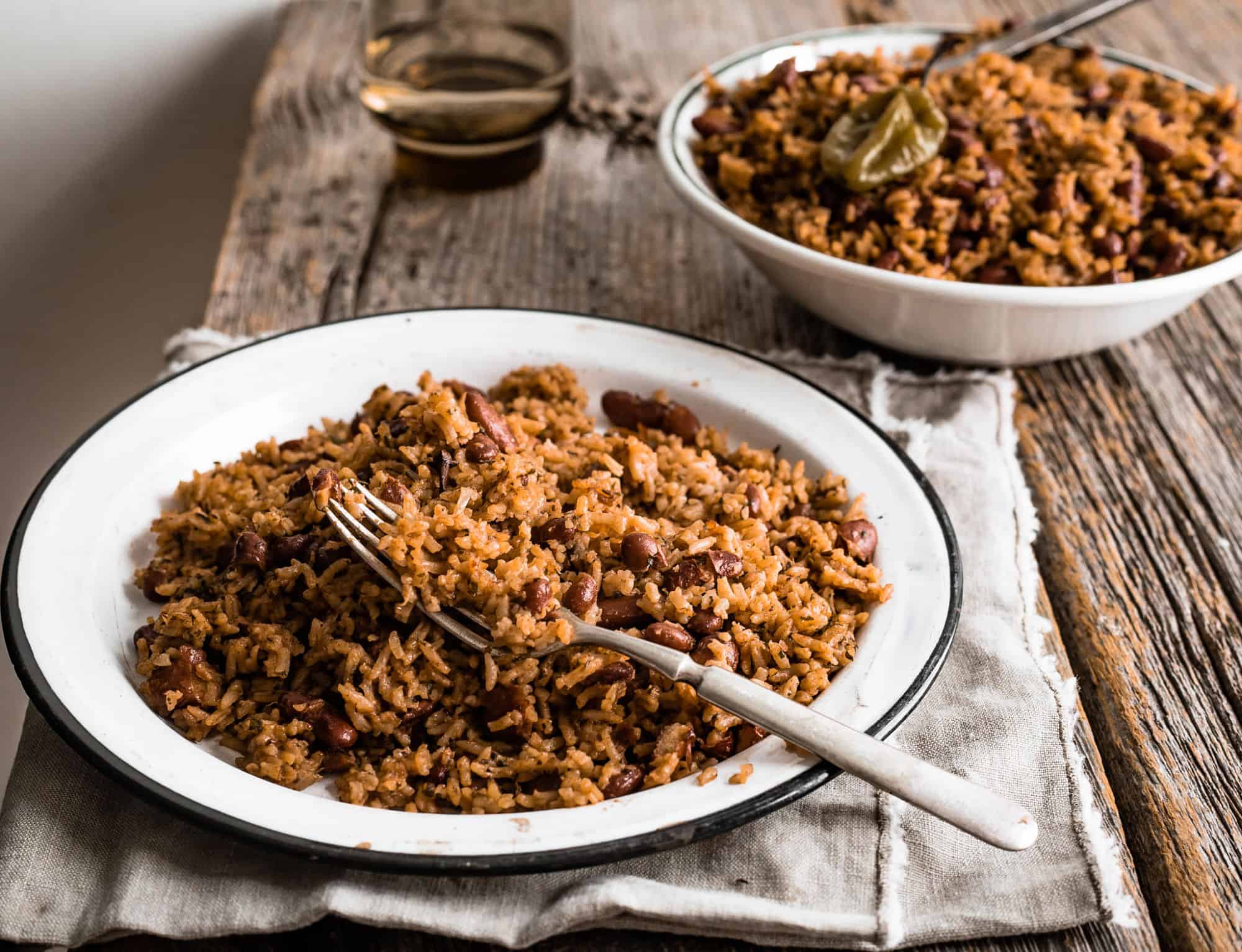 Dark rice in an enamel plate with a fork in it