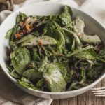 Spinach salad with sliced avocado and cranberry with poppy seeds vinaigrette