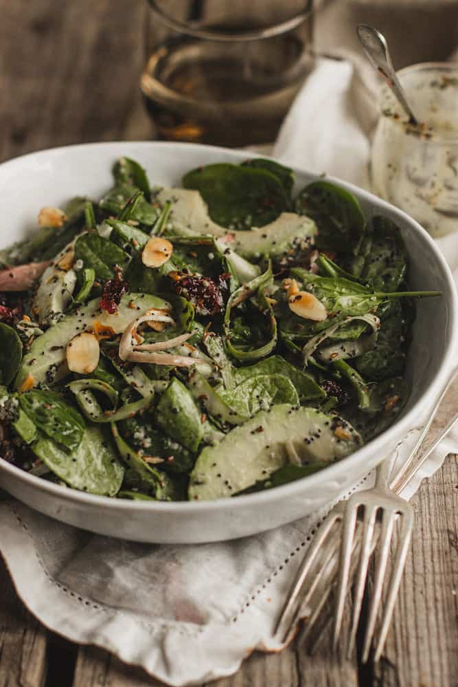 Spinach salad with avocados and slivered almonds