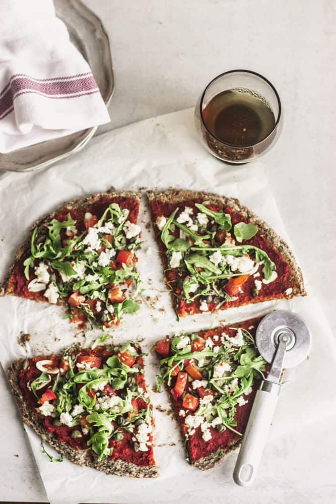 Bird's eye view of pizza cut in four slices and spread apart