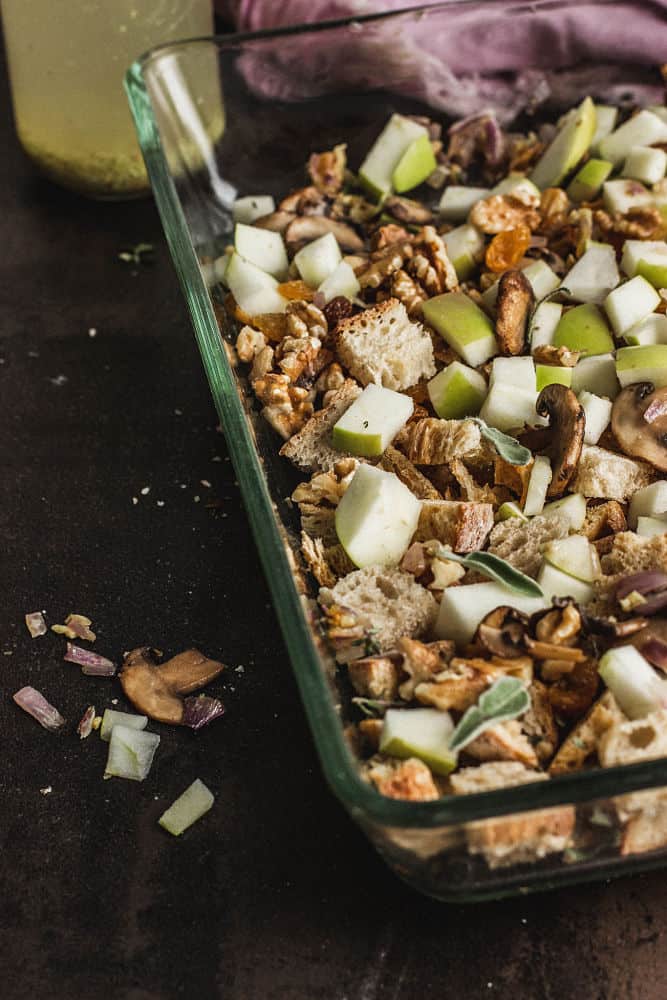 croutons, diced apples, walnuts, sage leaves in a casserole dish