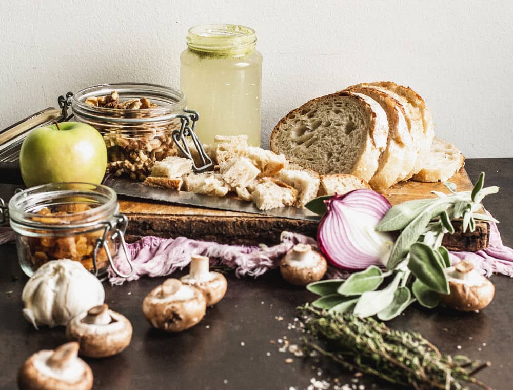 Ingredients to make vegan stuffing displayed in a still life style.