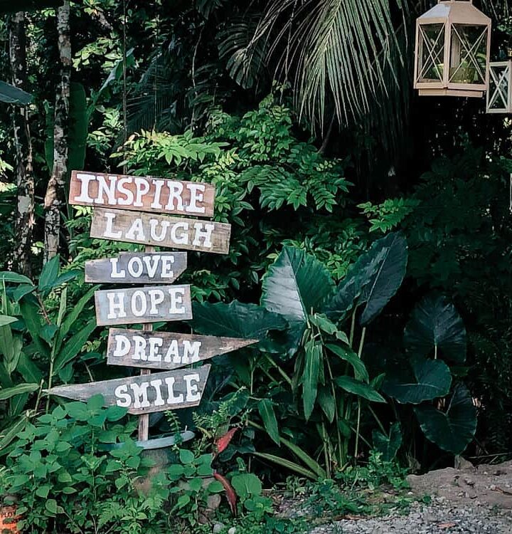 Inspiration signs in front of green leaves in Costa Rica Trip - Puerto Viejo