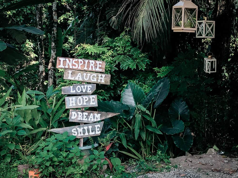 Inspiration signs in front of green leaves in Costa Rica Trip - Puerto Viejo