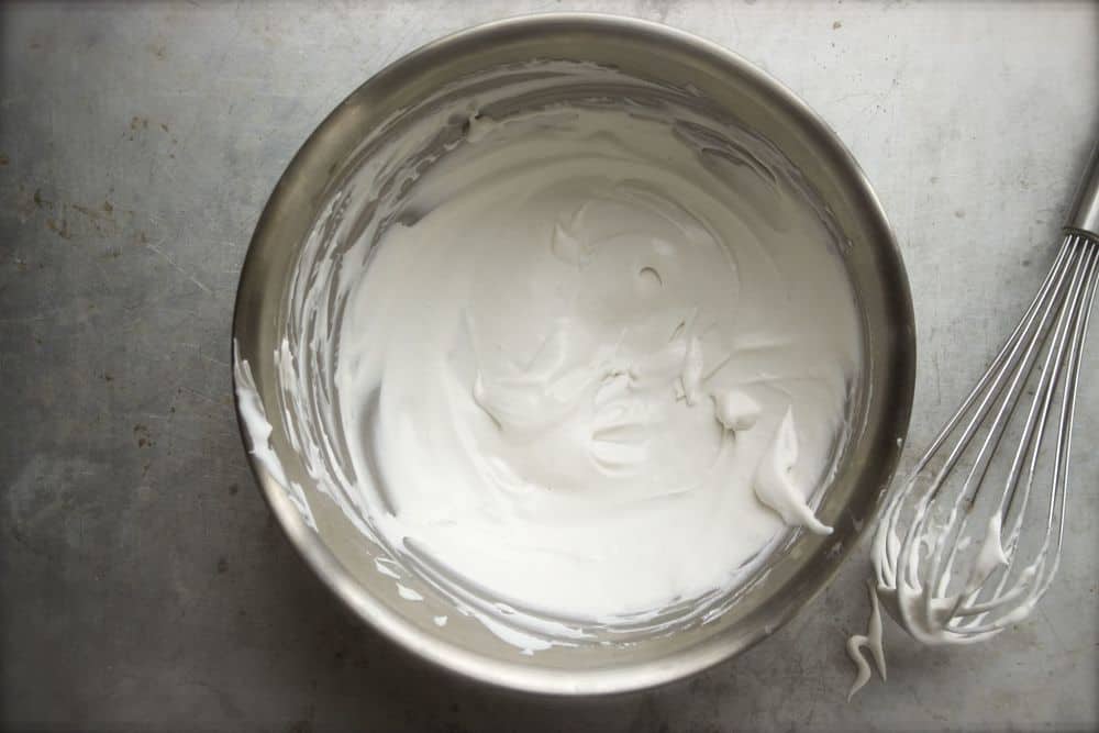 Overhead view of whipped coconut cream in a bowl