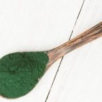 Top view of a spoonful of spirulina