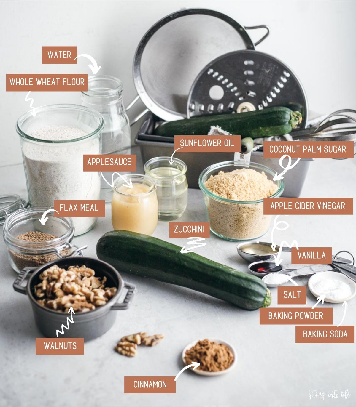 Vegan zucchini bread ingredients spread on a surface