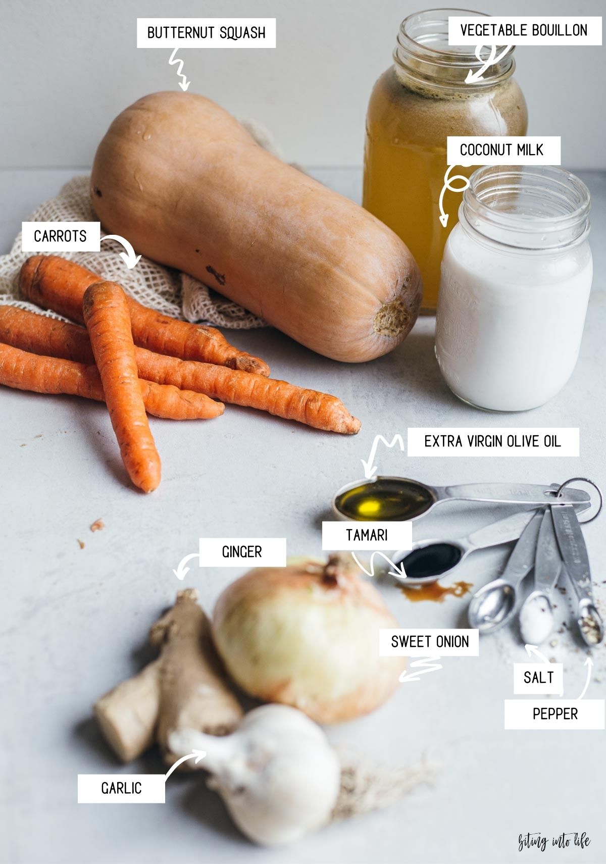 Ingredients for Velvety Butternut Squash Soup with Carrots and Ginger Spread on a Surface