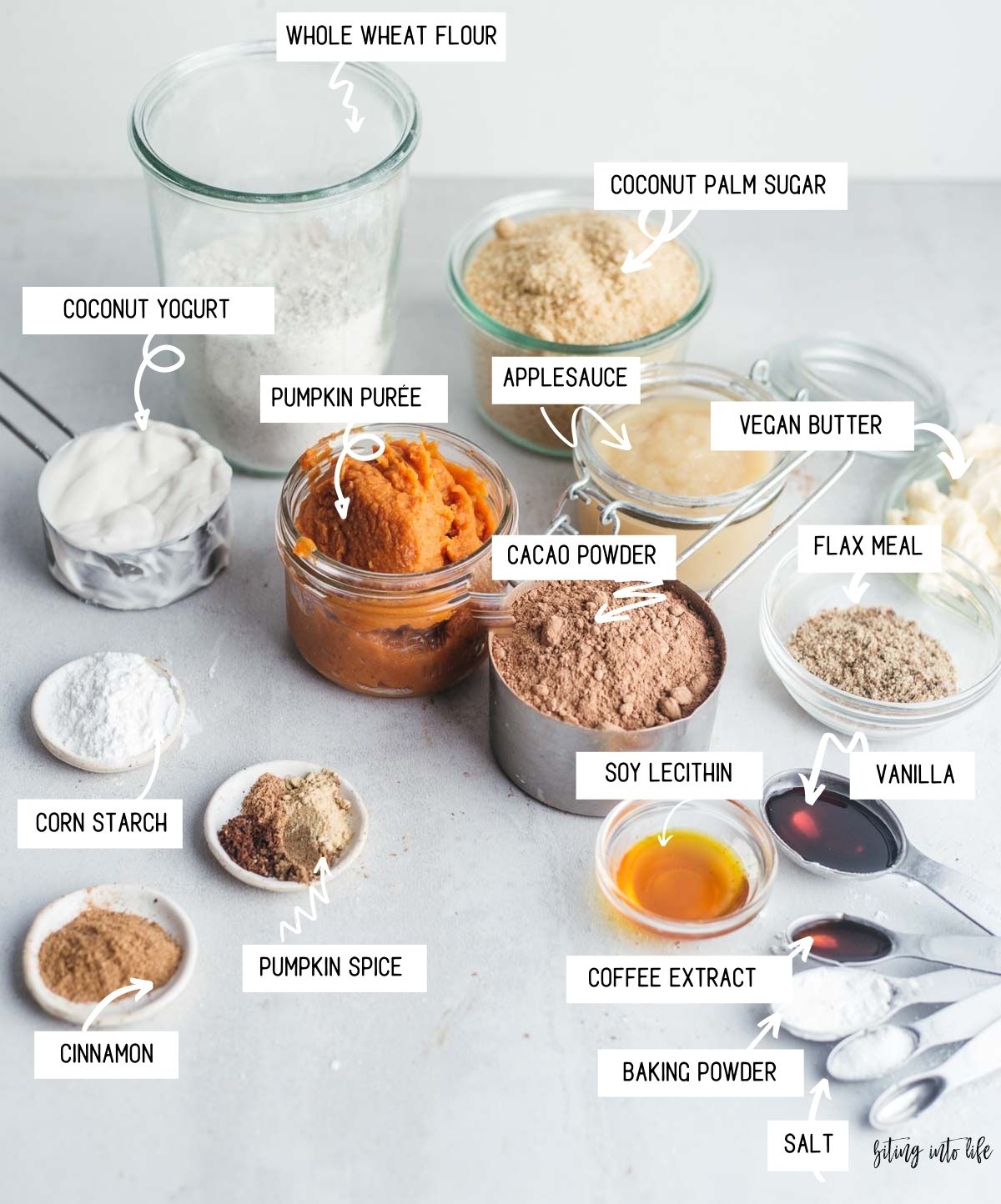 Ingredients for vegan pumpkin brownies spread out on a surface