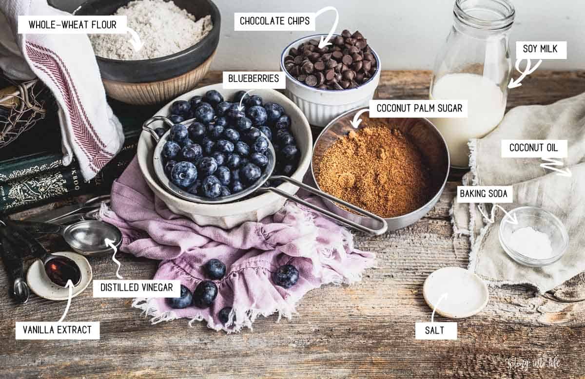 Blueberry Chocolate Chip Muffin Ingredients spread on a surface.